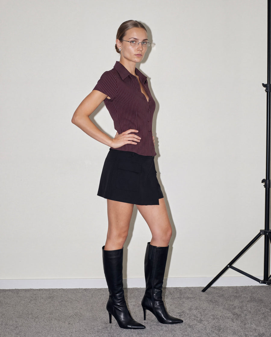 Fitted Button-Up Shirt in dark brown worn by model with mini skirt and boots