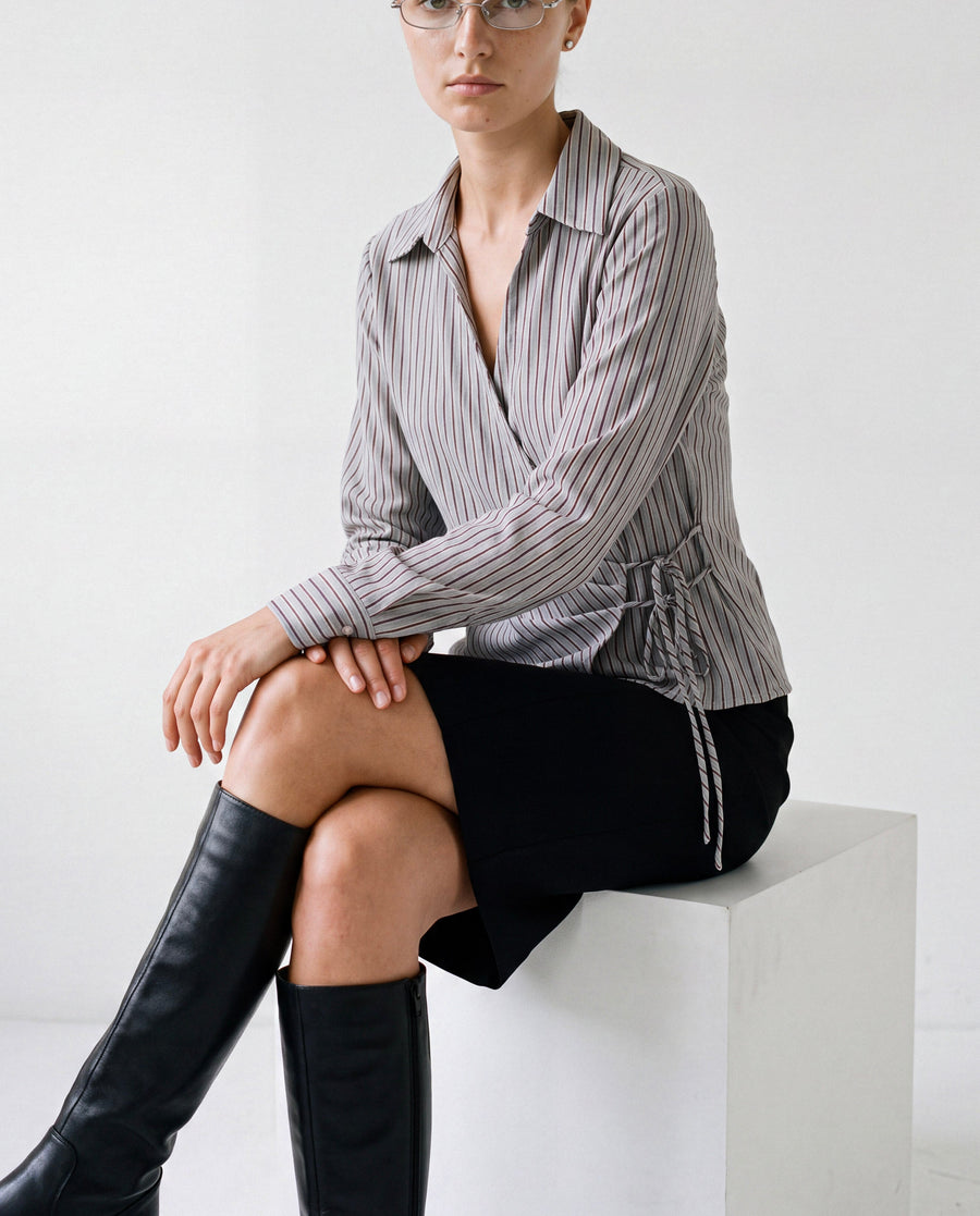 Asymmetric Striped Shirt in grey stripe worn by model, seated