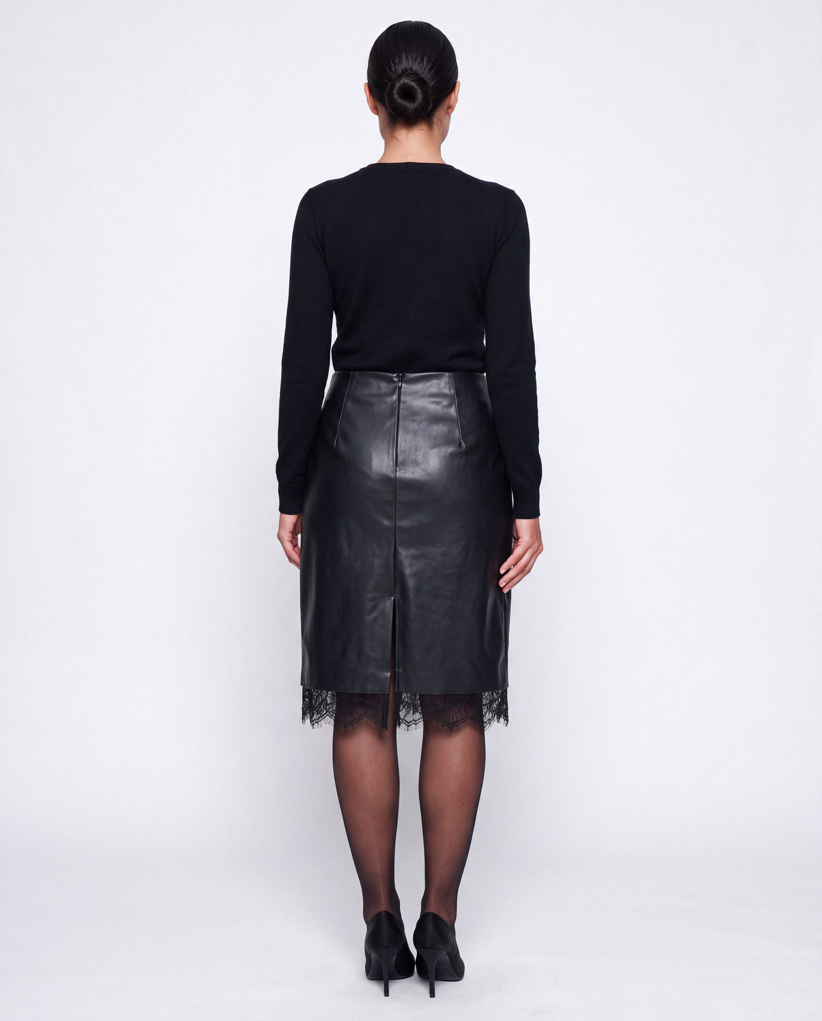 Lace-Trim Faux Leather Midi Skirt in black, back view showing the zip, back slit and lace hem