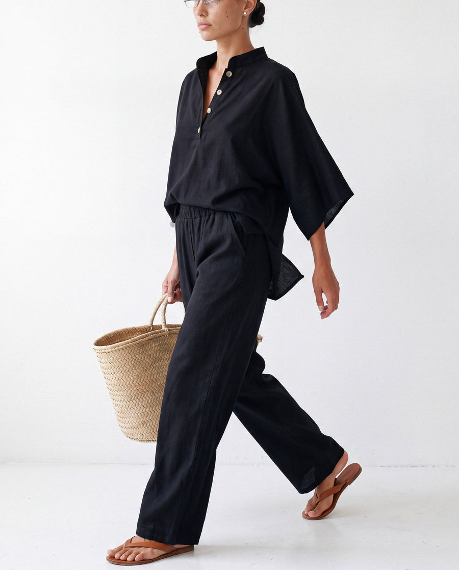 Band-Collar Shirt Set in black worn by model, walking
