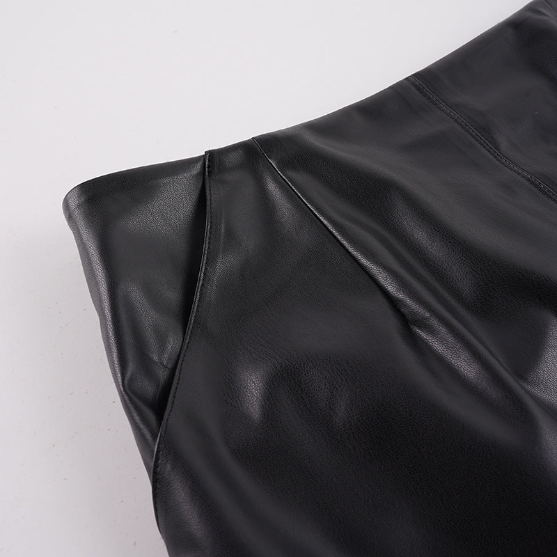 Close-up of the matte faux leather and hip pocket of the Lace-Trim Faux Leather Midi Skirt