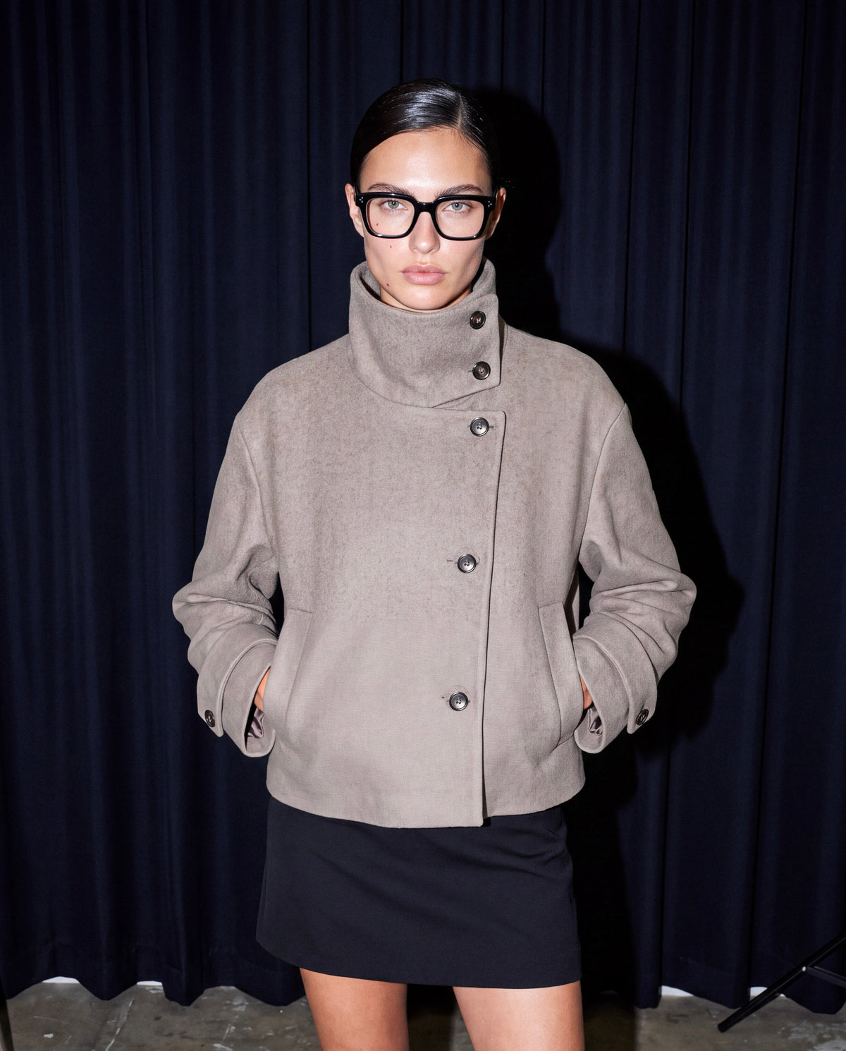 Stand-Collar Jacket in taupe worn by model, full length